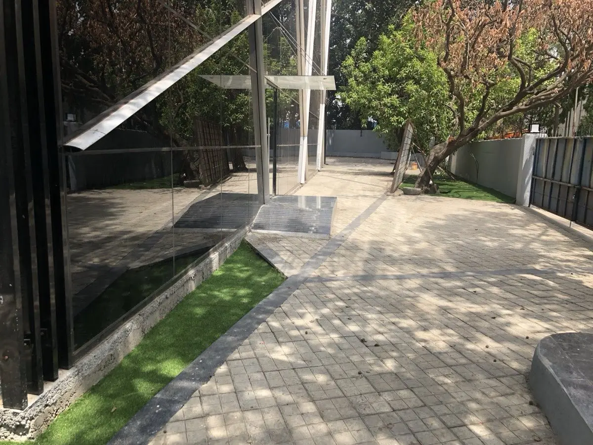 Office courtyard with glass facade and landscaping