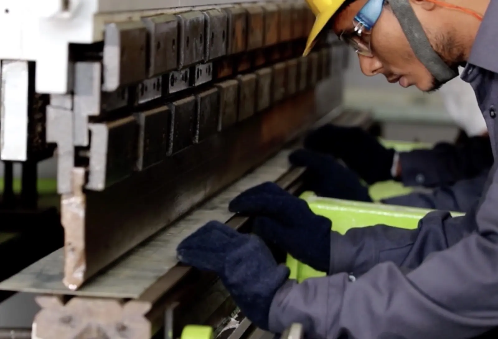 Worker operating press brake machine